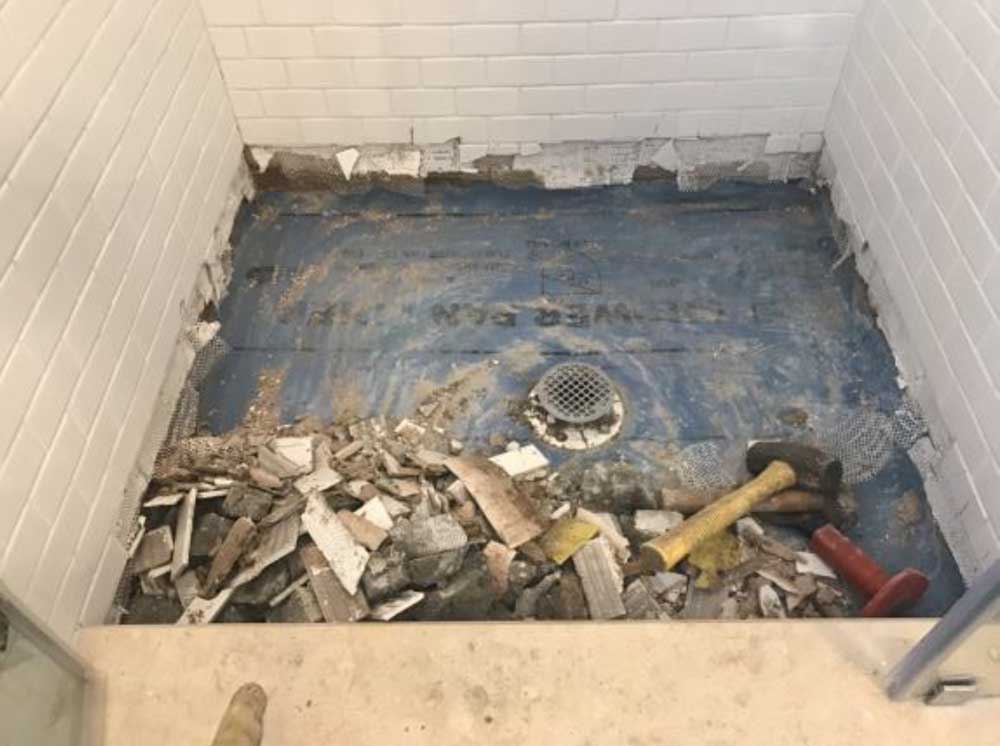 2- Demolition of tile, mud pan and walls